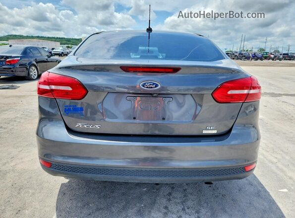1FADP3FE0JL321821 2018 FORD FOCUS Gray Vista trasera