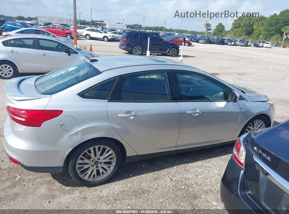 1FADP3J20HL291548 2017 FORD FOCUS Серебряный Вид задней части салона