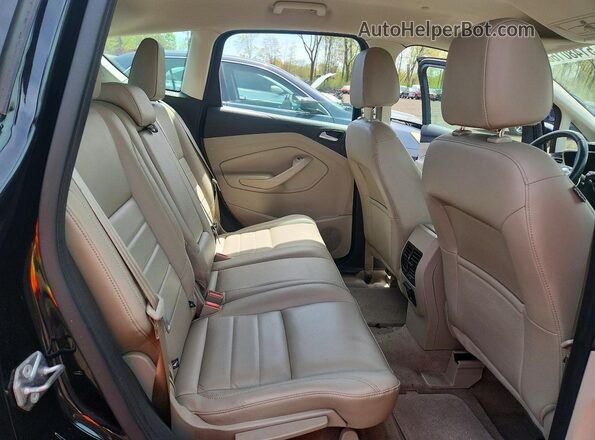 1FADP5CUXGL100517 2016 FORD C-MAX Black Vista de los asientos traseros