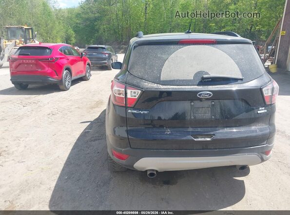 1FMCU9GD4JUD08566 2018 FORD ESCAPE Черный Вид задней части салона