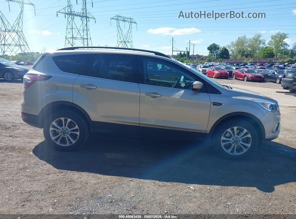 1FMCU9GD9JUC54424 2018 FORD ESCAPE Gold Widok wnętrza z tyłu