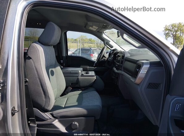 1FTFW1E53PFB24628 2023 FORD F150 Серебряный Вид салона спереди