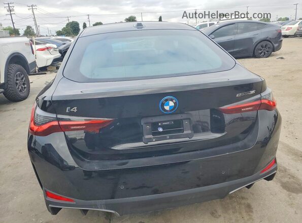WBY43AW04RFS63784 2024 BMW I4 Black Vista interior delantera