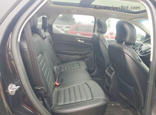 2FMPK3J90JBB18827 2018 FORD EDGE Черный Вид задней части салона