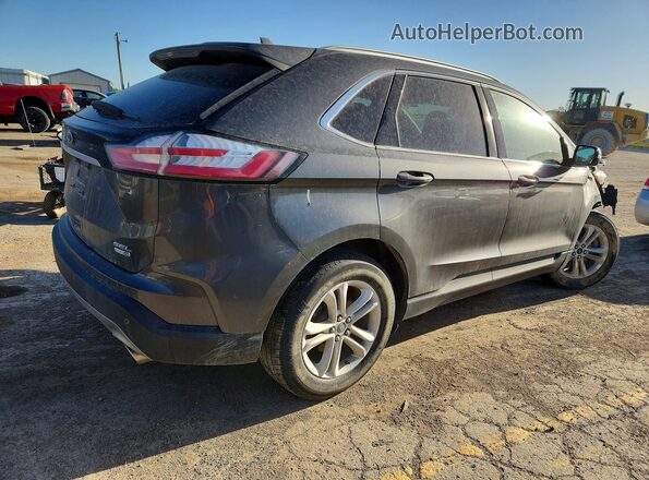 2FMPK4J97KBB89532 2019 FORD EDGE Gray Trasero derecho