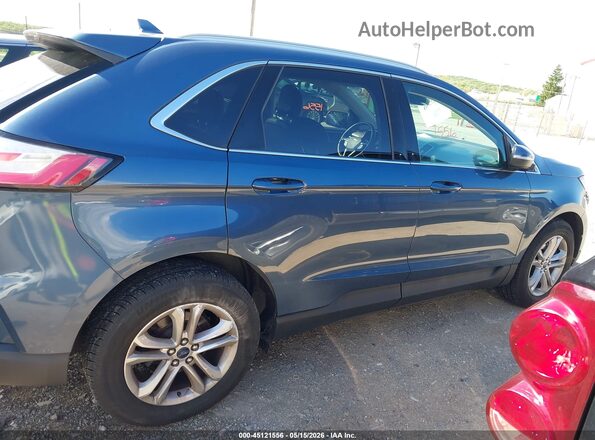2FMPK4J99KBB03136 2019 FORD EDGE Blue Widok wnętrza z tyłu