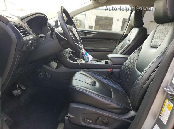 2FMPK4K99PBA47463 2023 FORD EDGE Серебряный Вид салона спереди