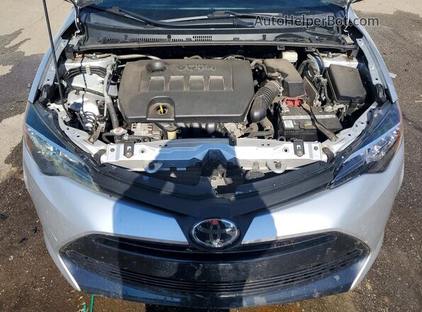 2T1BURHE0KC138275 2019 TOYOTA COROLLA Серебряный Вид задней части салона