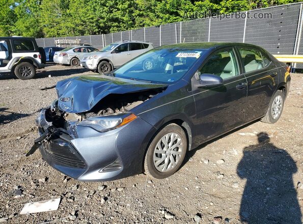 2T1BURHE0KC200192 2019 TOYOTA COROLLA Blue Vista tres cuartos delantera izquierda