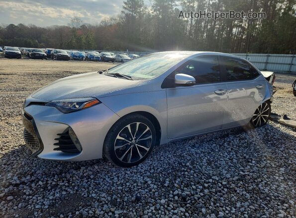2T1BURHE2HC828618 2017 TOYOTA COROLLA Серебряный Передняя левая четверть