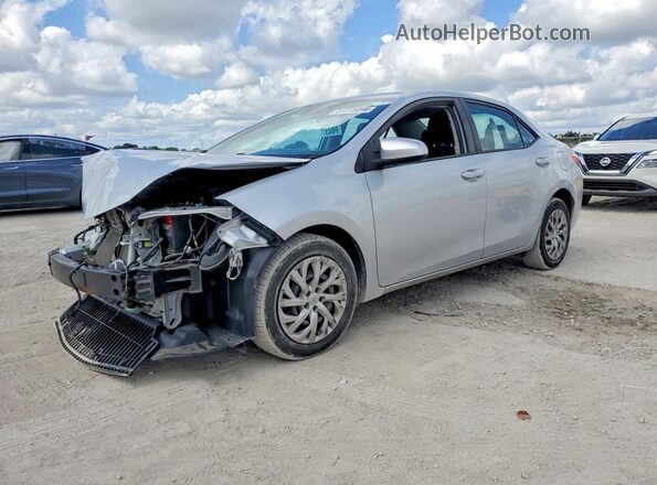 2T1BURHE2KC139878 2019 TOYOTA LL Серебряный Передняя левая четверть