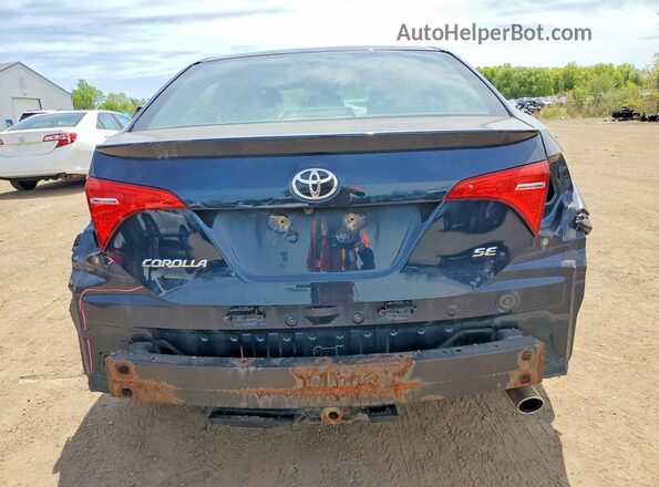 2T1BURHE8JC057104 2018 TOYOTA COROLLA Синий Вид сзади