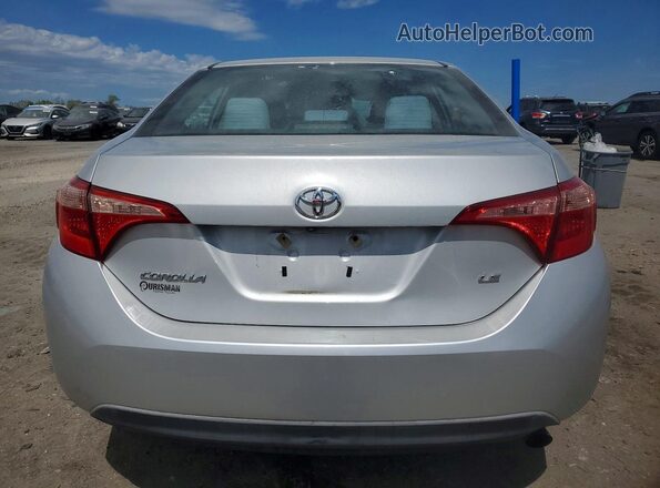 2T1BURHE9JC983561 2018 TOYOTA LL Серебряный Вид сзади