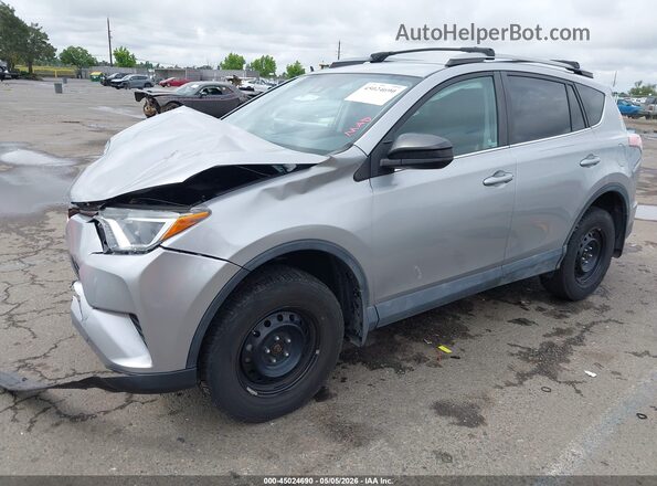 2T3BFREVXJW856497 2018 TOYOTA LE Silver Front left