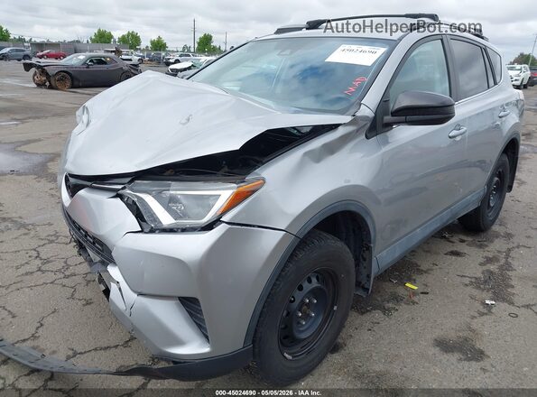 2T3BFREVXJW856497 2018 TOYOTA LE Silver Front view