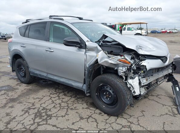 2T3BFREVXJW856497 2018 TOYOTA LE Silver Front right
