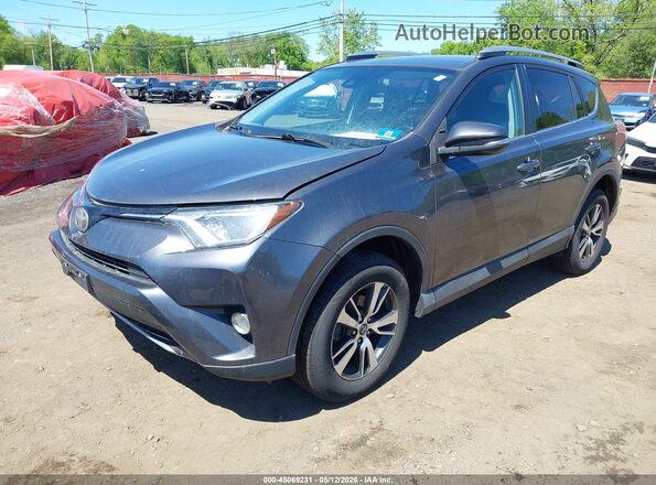 2T3RFREV5JW810168 2018 TOYOTA LE Gray Vista tres cuartos delantera izquierda