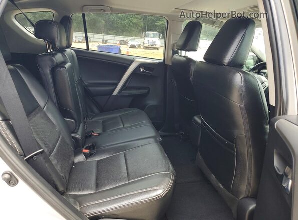 2T3RFREV8GW509323 2016 TOYOTA RAV4 Silver Widok wnętrza z tyłu