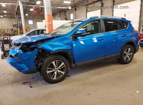2T3RFREVXJW796946 2018 TOYOTA RAV4 Blue Vista tres cuartos delantera izquierda