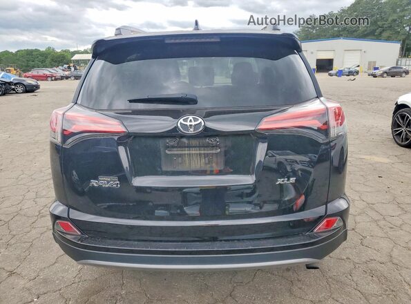 2T3WFREV4HW321371 2017 TOYOTA RAV4 Black Rear view