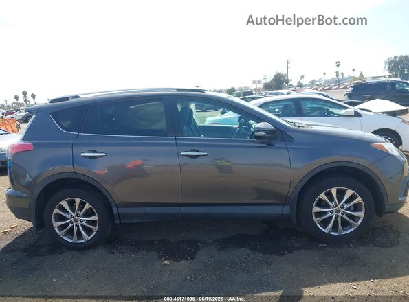 2T3YFREV7GW301333 2016 TOYOTA RAV4 Gray Vista interior trasera