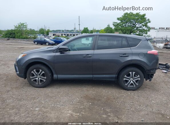 2T3ZFREV2HW382649 2017 TOYOTA RAV4 Gray Vista interior trasera