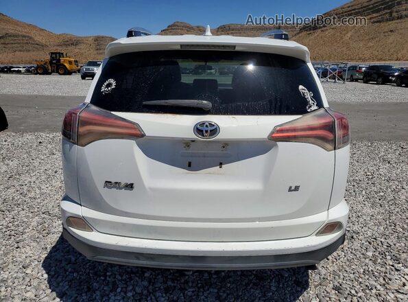 2T3ZFREV5GW258812 2016 TOYOTA RAV4 White Rear view