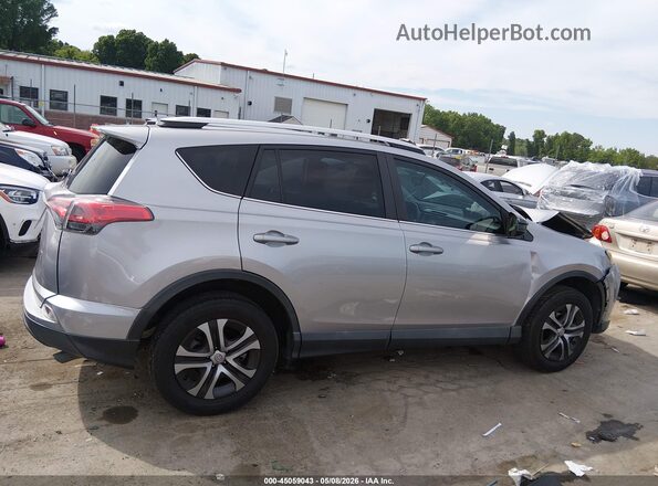 2T3ZFREV7GW252056 2016 TOYOTA LE Серый Вид задней части салона