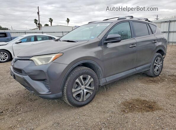 2T3ZFREV9GW235128 2016 TOYOTA RAV4 Gray Vista tres cuartos delantera izquierda