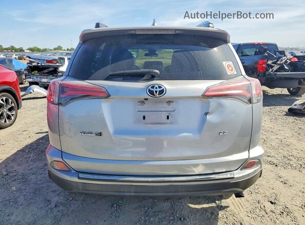 2T3ZFREV9HW387671 2017 TOYOTA RAV4 Серебряный Вид сзади
