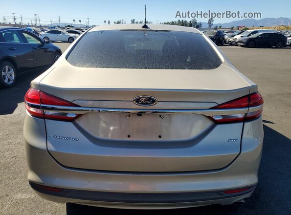 3FA6P0H71HR382497 2017 FORD FUSION Желто-коричневый Вид сзади