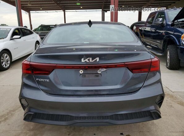 3KPF24AD7PE634422 2023 KIA FORTE Серый Вид сзади