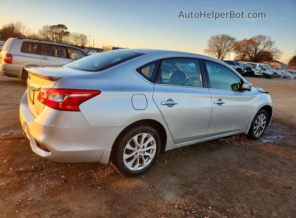 3N1AB7AP0KY240499 2019 NISSAN SENTRA Серебряный Задняя правая четверть