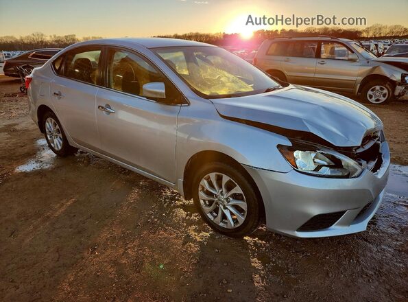 3N1AB7AP0KY240499 2019 NISSAN SENTRA Серебряный Передняя правая четверть