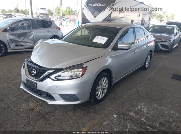 3N1AB7AP1KY404844 2019 NISSAN SENTRA Серебряный Передняя левая четверть