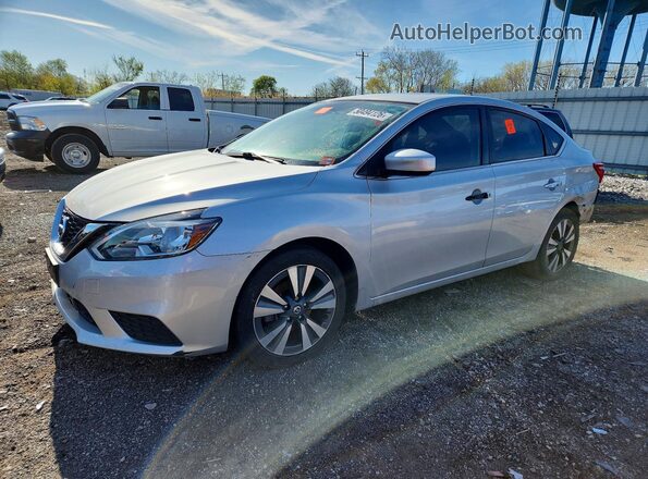 3N1AB7AP5KY242233 2019 NISSAN SENTRA Серебряный Передняя левая четверть