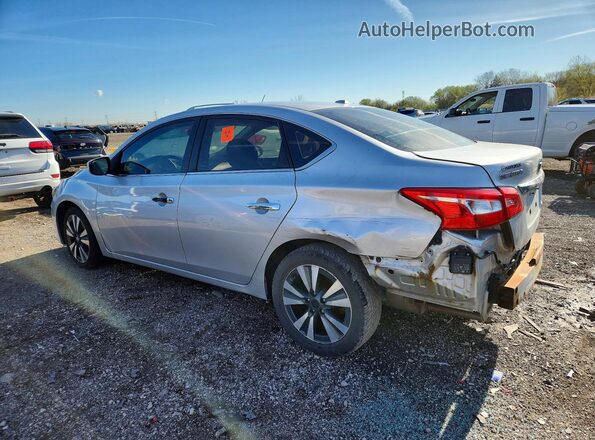 3N1AB7AP5KY242233 2019 NISSAN SENTRA Серебряный Задняя левая четверть