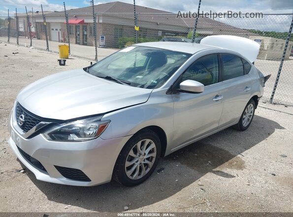 3N1AB7AP5KY328982 2019 NISSAN SENTRA Silver Առջևի ձախ երեք քառորդ տեսարան