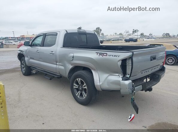 3TMBZ5DN3KM021751 2019 TOYOTA TACOMA Silver Trasero izquierdo