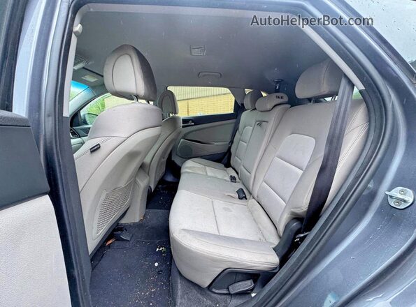 KM8J3CA2XGU194869 2016 HYUNDAI TUCSON Gray Vista trasera