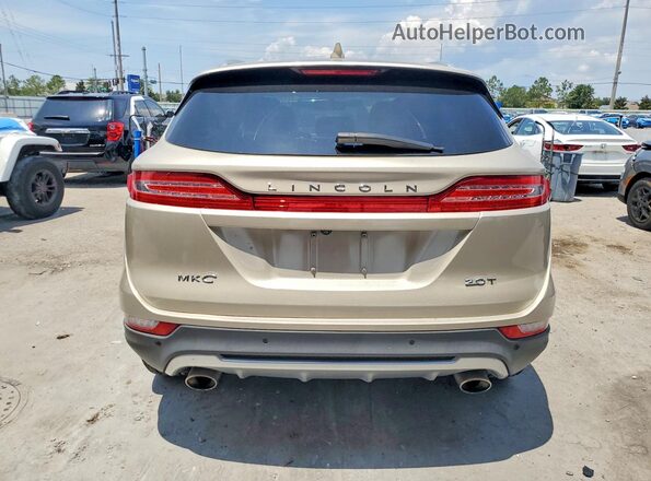 5LMCJ1C91HUL09595 2017 LINCOLN MKC Beige Vista trasera