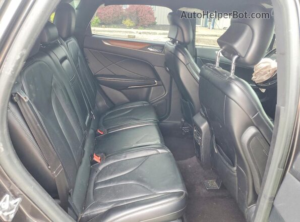 5LMCJ2D98HUL45322 2017 LINCOLN MKC Charcoal Rear interior view