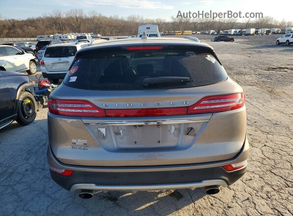 5LMCJ3C9XKUL15544 2019 LINCOLN MKC Tan Вид ззаду