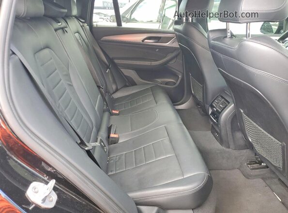 5UX2V1C02L9B14613 2020 BMW X4 Black Widok wnętrza z tyłu