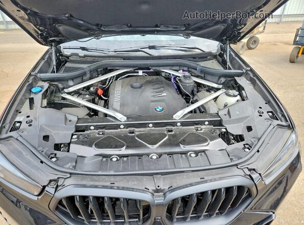 5UX33EX03S9W72705 2025 BMW X6 Black Widok wnętrza z tyłu