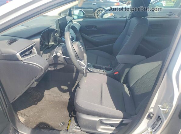 5YFB4MDE3PP036629 2023 TOYOTA COROLLA Серебряный Вид салона спереди