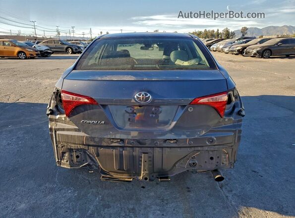 5YFBURHE4HP665678 2017 TOYOTA COROLLA Серый Вид сзади
