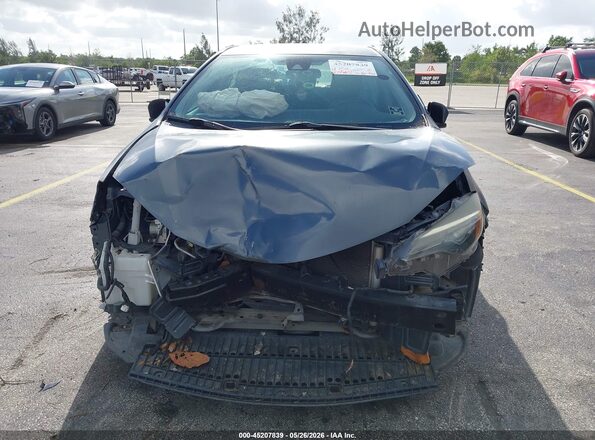 5YFBURHE4HP723899 2017 TOYOTA COROLLA Серый Вид задней части салона