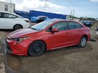2020 Toyota Corolla Le Red vin: 5YFEPRAE7LP056043 Damage: Left Front Wheel Cover, Missing, Replacement Required