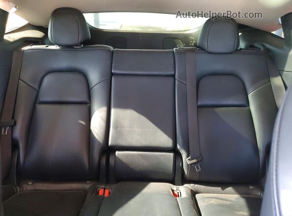 5YJYGDEE5MF297476 2021 TESLA MODEL Black Vista de los asientos traseros